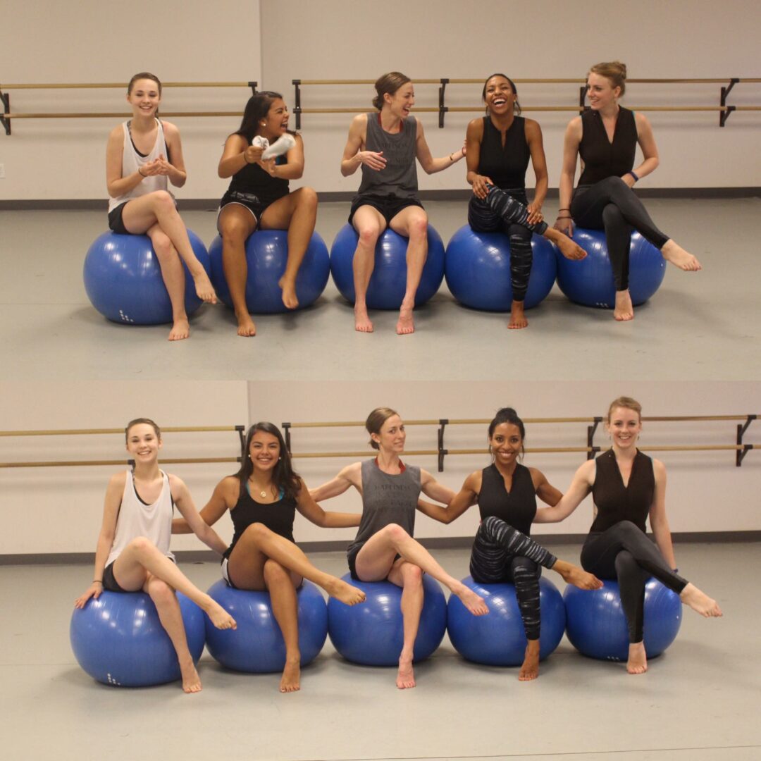 A group of dancers sitting on blue balls.