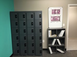 Lockers and bookshelves in an office.