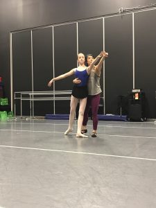 Two dancers in a dance studio.